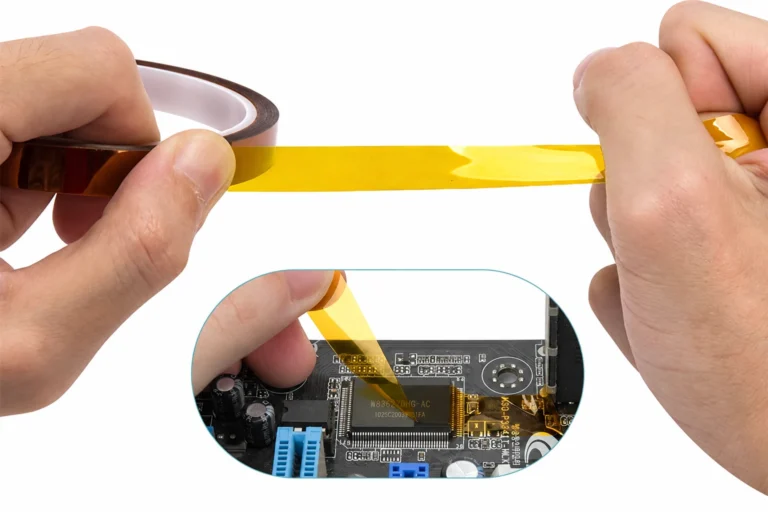 Hands holding a strip of amber polyimide tape, with an inset showing tape on a circuit board.
