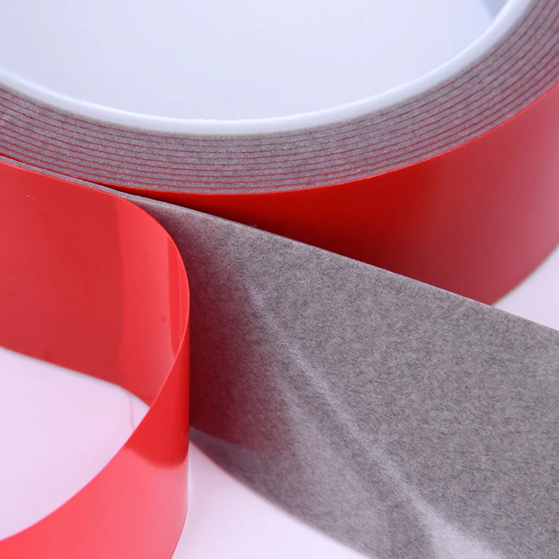 Grey acrylic foam die-cut tape parts with red release backing
