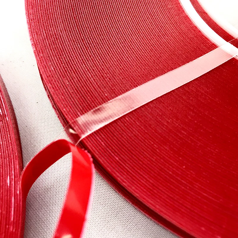 Transparent acrylic foam tape rolls with red release backing