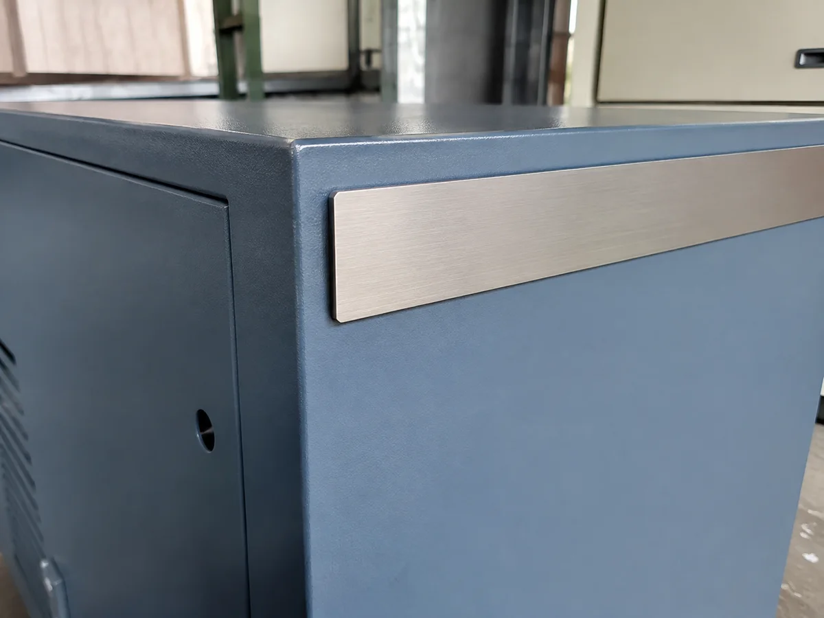 Illustrated application: Metal trim fitted to a powder-coated industrial enclosure